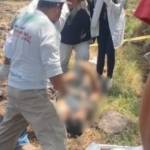 Hallan cuerpo en canal de aguas negras en Mixquiahuala